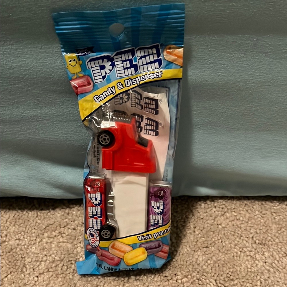 Red and White Toy Car with Candy Dispenser
